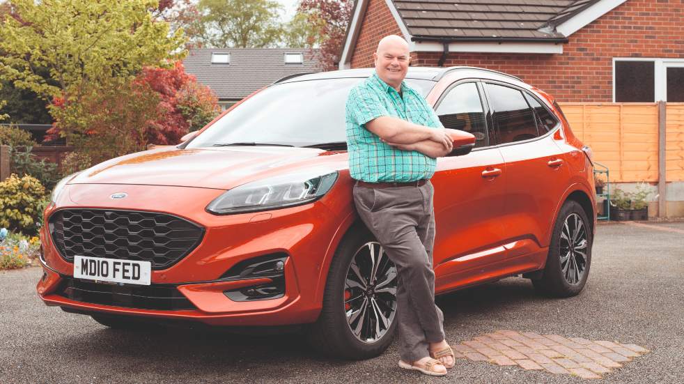 mike dockerwith his ford kuga plug-in hybrid